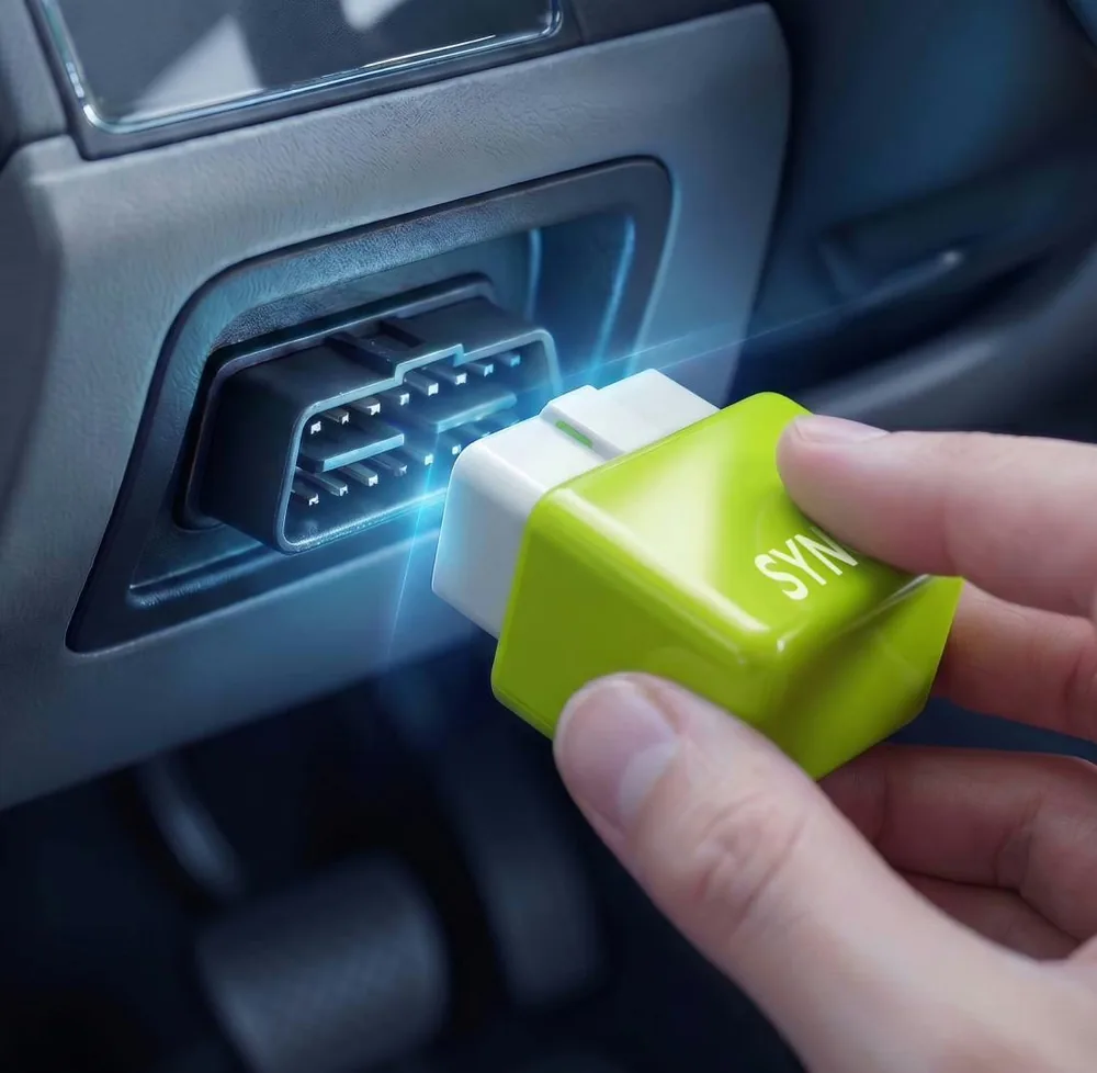 SynGas fuel saver installed in an OBD2 port — order it from the official website